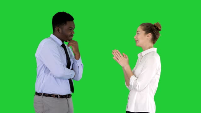 Business-woman-giving-some-ideas-to-her-boss-on-a-Green-Screen,-Chroma-Key
