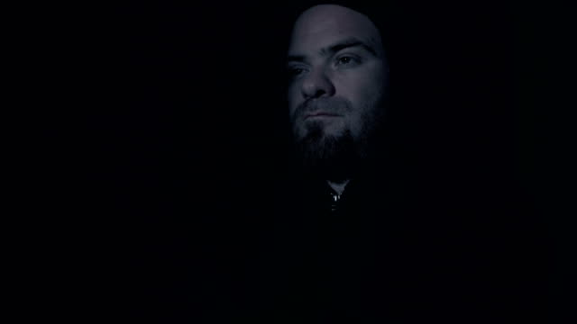 close-up-on-Sad-and-thoughtful-man-with-hood-in-the-dark