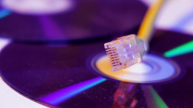 Closeup-of-Ethernet-cable-with-it's-reflection-on-blank-disc