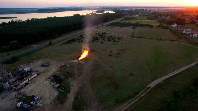 Aerial-shooting-Flaring-of-high-pressure-gas-from-the-gas-well-at-sunset.