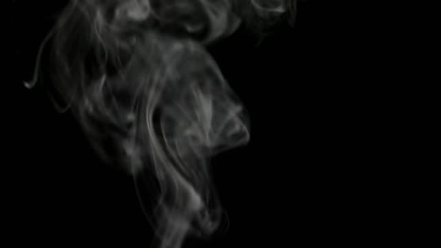 Real white steam on black background. Real white steam isolated on