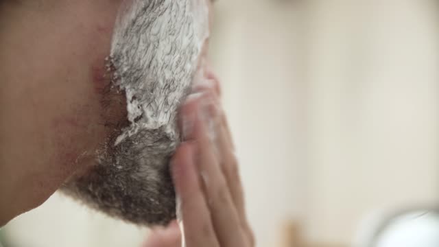 Men-Hygiene.-Male-Applying-Shaving-Foam-On-Beard-Closeup