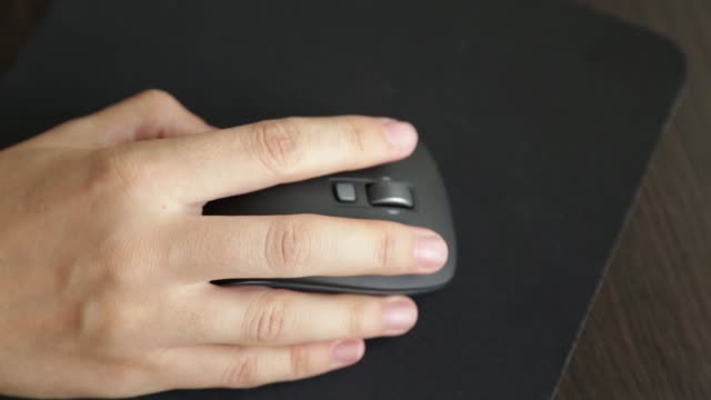 female-hand-on-computer-mouse