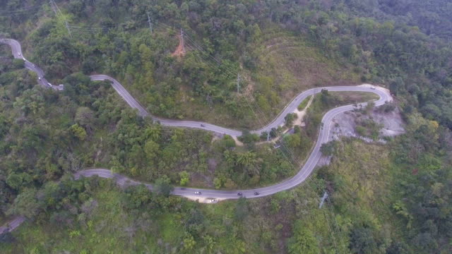 Aerial-shot-:-Car-Driving-Along-Winding-Road-on-mountain