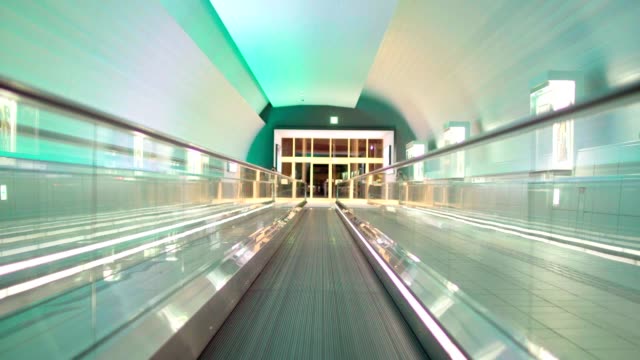 Illuminated,-empty,-multi-colored-moving-walkway