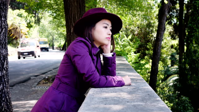 pensive-serious-Asian-Woman-Portrait-,-outdoor