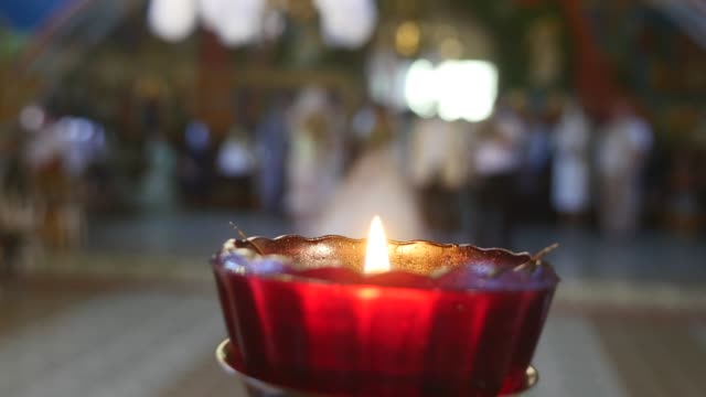 close-up-of-candle-on-church-background.-selective-focus
