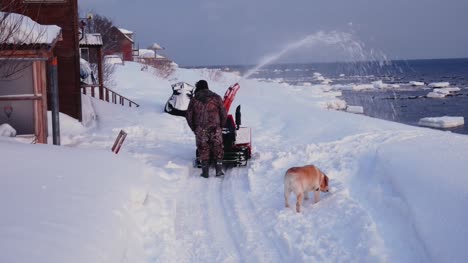 Man-Cleans-The-Snow-Machine-Road-From-Snow-In-The-Winter