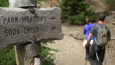 Hikers-follow-sign-to-a-meadow