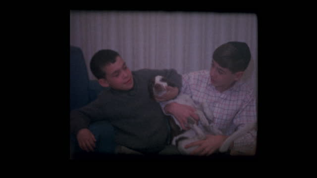 Jewish-boy-wearing-yarmulke,-little-brother-and-their-pet-dog