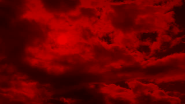 Rojo-apocalíptico-cielo-con-sol-detrás-de-las-nubes