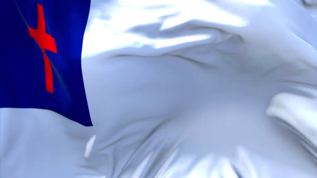 Christian-Fähnchen-im-Wind-Slow-Motion-Animation.-4K-glatt-realistische-Stoff-Textur-Flagge-weht-an-einem-windigen-Tag-kontinuierliche-nahtlose-Schleife-Hintergrund.