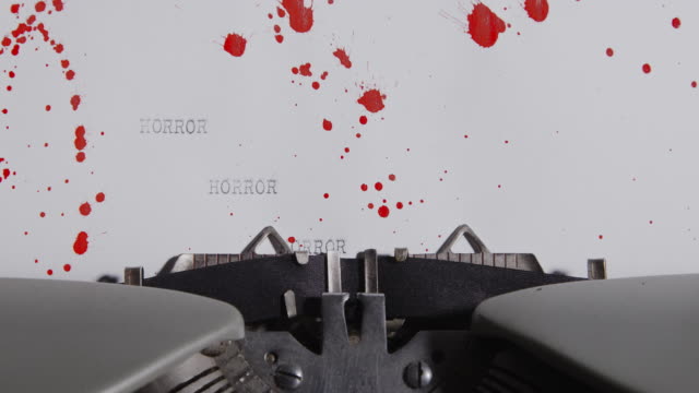 Typewriter-spelling-horror-on-blood-stained-paper