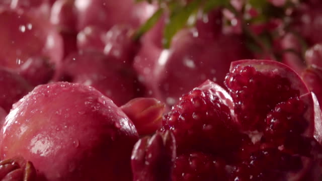 Water-drops-into-the-pomegranate-.-Slow-motion