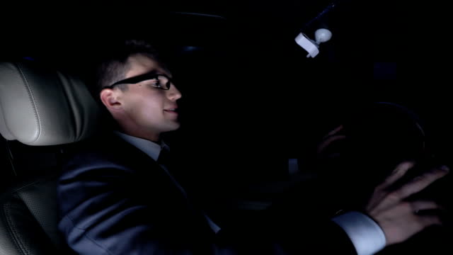 Angry-businessman-furiously-hitting-steering-wheel-in-car-at-nighttime,-problems