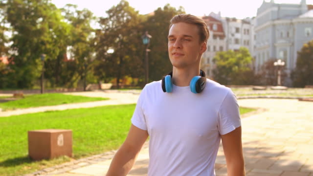 portrait-attractive-young-man-walks-outdoor
