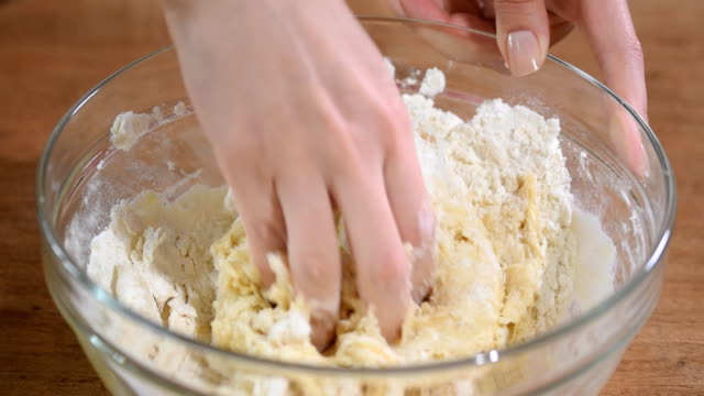 Woman-kneading-dough,-close-up.
