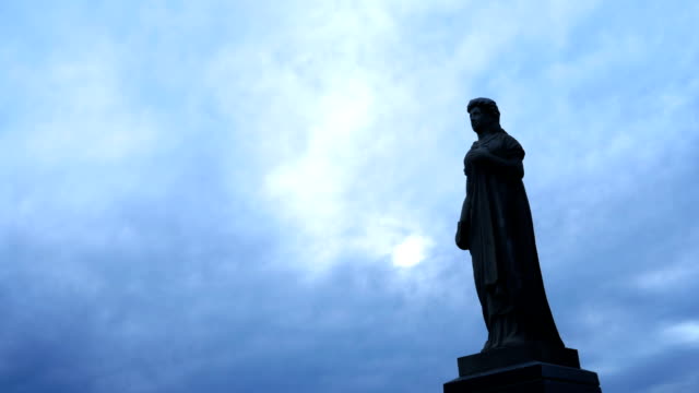 A-Creepy-eerie-timelapse-of-fog-over-a-cemetery-statue---includes-normal-and-graded-version