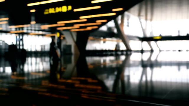 Defocused-airport-baackground.-Silhouette-people-walking-at-the-airport.