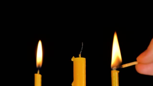 Burning-Candle-With-Black-Background.