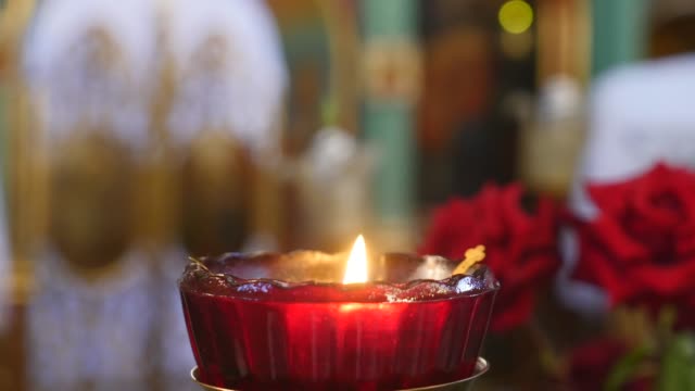 close-up-of-candle-on-church-background.-selective-focus