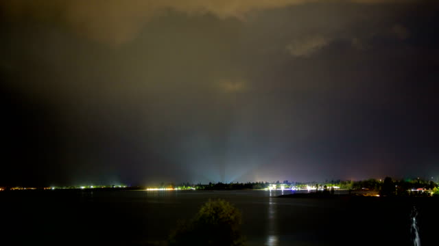 Laser-beam-on-the-horizon-during-a-thunderstorm-on-the-seashore
