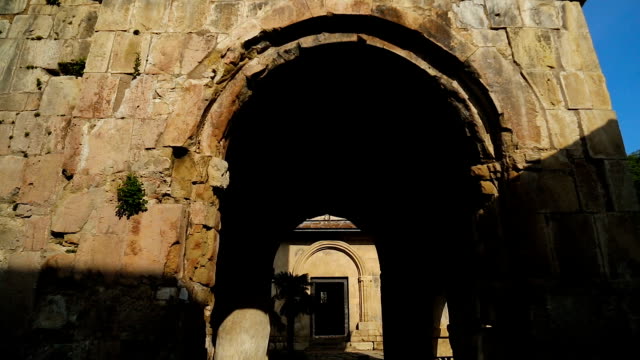 Outside-view-of-old-Gelati-Monastery-walls-and-arches,-ancient-architecture