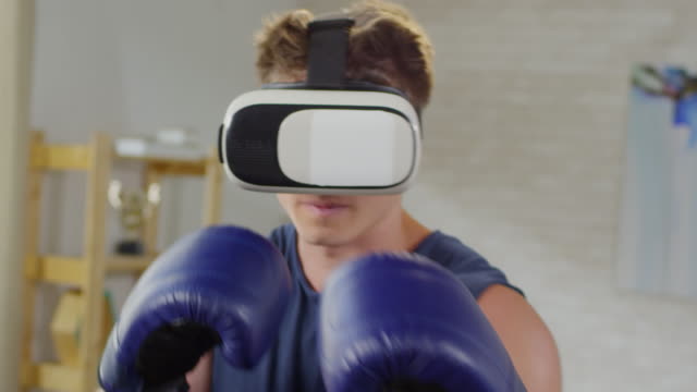 Sportsman-Practicing-Shadowboxing-in-VR-Goggles