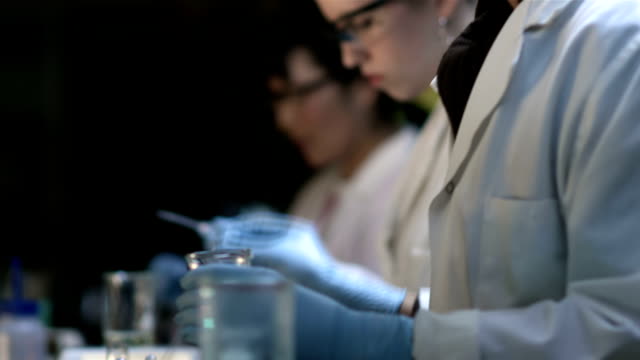 Close-up-of-experiments-being-conducted-in-a-chemistry-lab