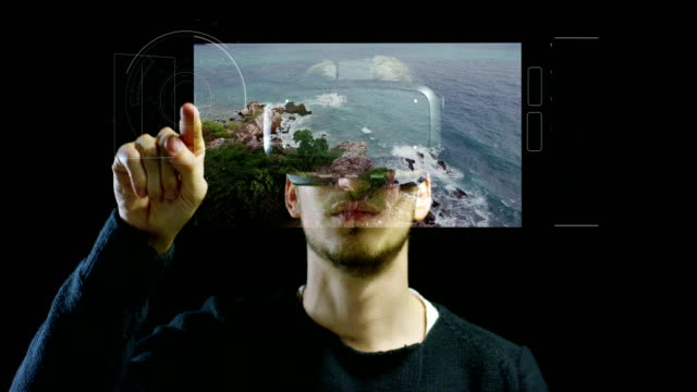 young-nice-man-using-3d-reality-in-life-with-oculus-and-augmented-reality-technology-with-implements-of-reality.