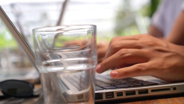 Female-Hands-Using-Computer-Laptop-Typing-on-Keyboard
