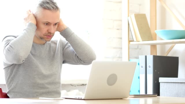 Failure-and-Upset-by-Loss,-Middle-Aged-Man-Working-on-Laptop
