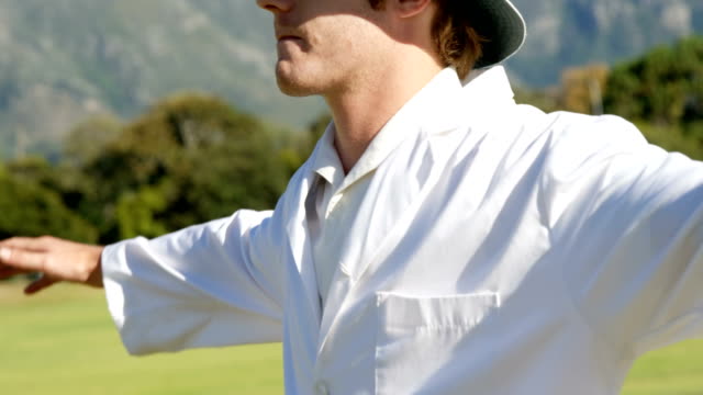 Cricket-umpire-signaling-wide-ball-during-match
