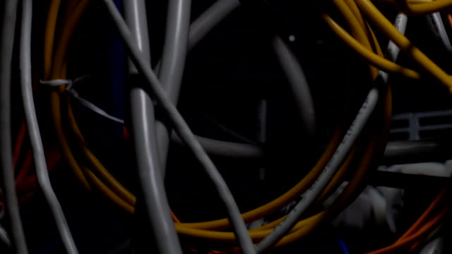 Grey-and-yellow-wires-close-up,-technological-progress,-telecommunications