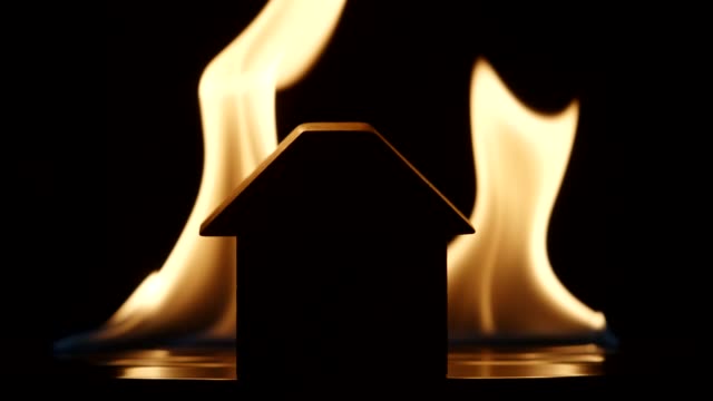 Silhouette-of-a-house-on-a-flaming-background---Slow-motion