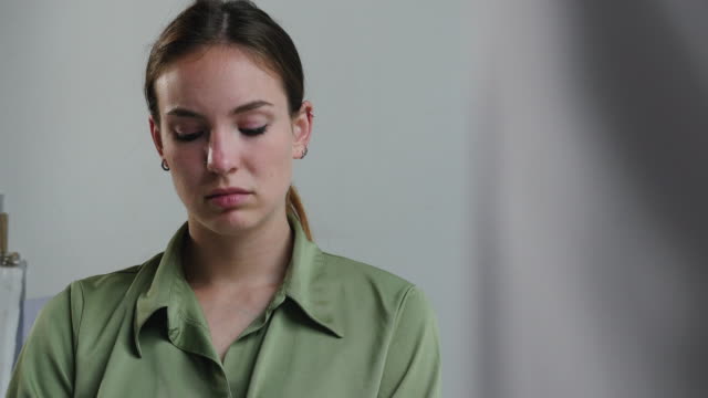 Sad-Young-Woman-at-an-Interview-2