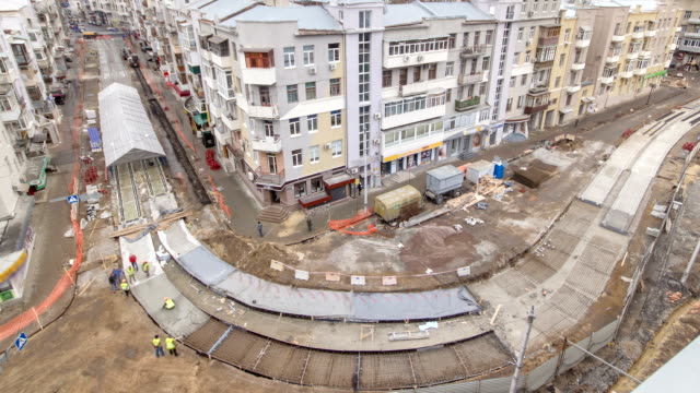 Concrete-works-for-road-maintenance-construction-with-many-workers-and-mixer-timelapse