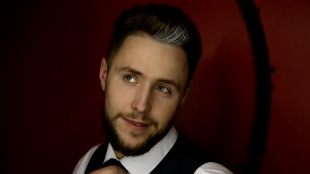 Elegant-young-bearded-handsome-man-posing-in--photo-studio