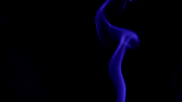 Blue-Steam-Rises-from-up.-Blue-smoke-over-a-black-background.-Smoke-slowly-floating-through-space-against-black-background.-Slow-Motion.