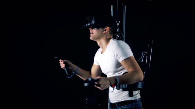 A-person-uses-equipment-to-play-VR-games.-Virtual-reality-gaming-concept.