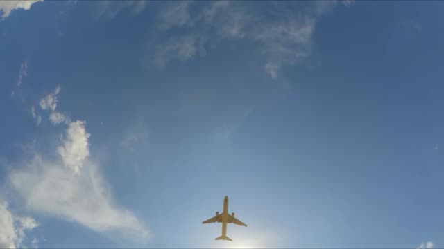 the-plane-flies-through-the-cloudy-sky.-Slow-motion