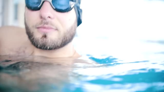 Handsome-bearded-man-in-a-swimming-pool.