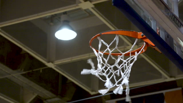 Basketball-free-throw-with-scoring.-Basketball-net-close-up.-Flat-plane.-Low-angle-shot
