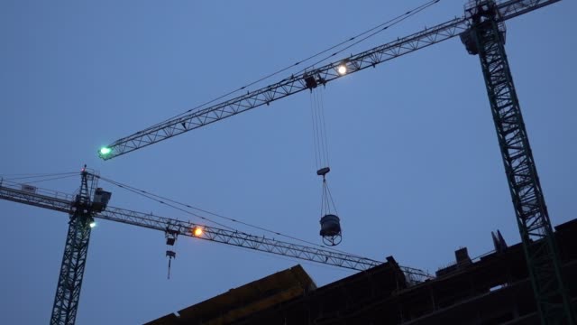 Construction-Crane-Works-In-The-Evening
