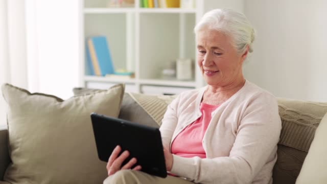senior-woman-with-tablet-pc-and-credit-card
