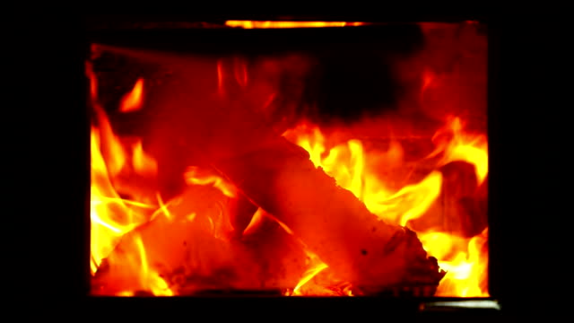 Burning-firewood-in-the-fireplace-closeup,-fire-and-flames