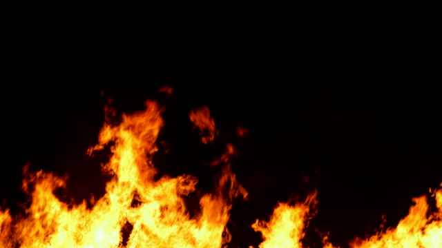 Slow-Motion-Sequence-Of-Fire-Flames-Against-Black-Background