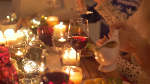 friends-eating-and-drinking-wine-at-christmas