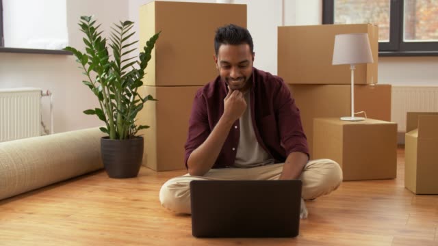 man-with-laptop-shopping-online-at-new-home