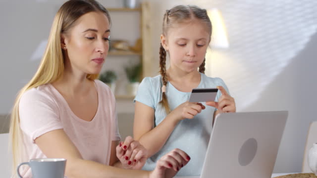 Mother-and-Daughter-Paying-with-Card-Online